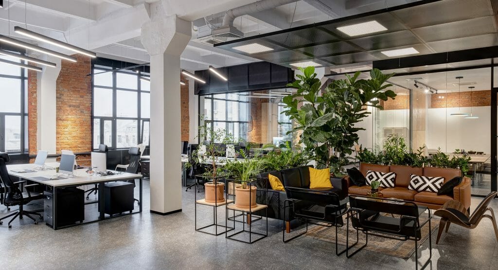 office_FPO Office space interior view - exposed brick, couches, and desk area