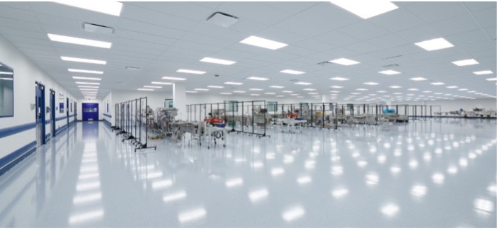 Inside an expansive production hall, integrated processing equipment reflects the precision and cleanliness modern facilities demand.