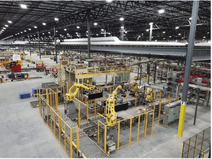 Robotics and automated material flow inside a high-volume production environment.
